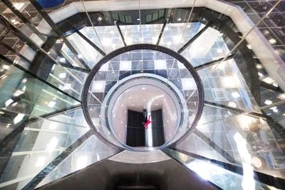 Low-angle view from the safety net of an instructor taxi flying a student near the top of the chamber.